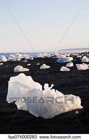 Large pieces of glacial ice washed up on beach, Jokulsarlon glacial lagoon, Iceland View Large Photo Image Stock Image - Large pieces of glacial ice washed up on beach, Jokulsarlon glacial lagoon, Iceland. Fotosearch