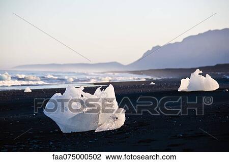 Large pieces of glacial ice washed up on beach, Jokulsarlon glacial lagoon, Iceland View Large Photo Image Stock Image - Large pieces of glacial ice washed up on beach, Jokulsarlon glacial lagoon, Iceland. Fotosearch