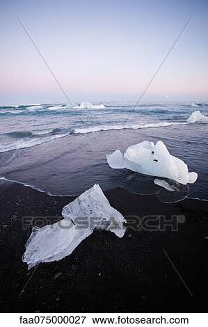 Large pieces of glacial ice washed up on beach, Jokulsarlon glacial lagoon, Iceland View Large Photo Image Stock Photo - Large pieces of glacial ice washed up on beach, Jokulsarlon glacial lagoon, Iceland. Fotosearch