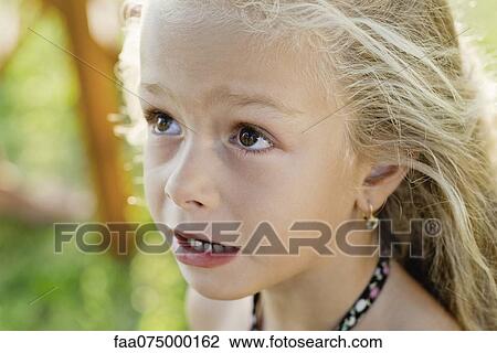 Littel girl looking up anxiously, portrait View Large Photo Image Stock Image - Littel girl looking up anxiously, portrait. Fotosearch