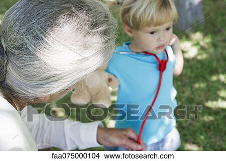 Little girl and grandmother, cropped View Large Photo Image Picture - Little girl and grandmother, cropped. Fotosearch