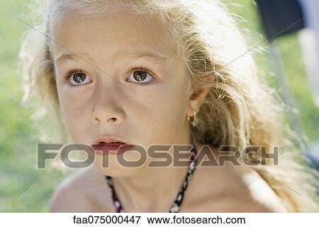Little girl looking up anxiously, portrait View Large Photo Image Stock Photo - Little girl looking up anxiously, portrait. Fotosearch