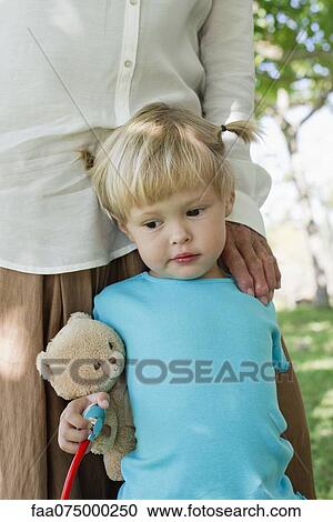 Little girl standing by grandmother, cropped View Large Photo Image Stock Image - Little girl standing by grandmother, cropped. Fotosearch