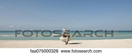 Man reading book at the beach View Large Photo Image Stock Photo - Man reading book at the beach. Fotosearch