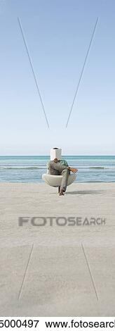 Man reading book at the beach View Large Photo Image Stock Photo - Man reading book at the beach. Fotosearch