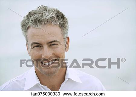 Man smiling at camera, portrait View Large Photo Image Stock Image - Man smiling at camera, portrait. Fotosearch