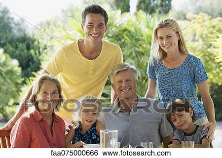Stock Photograph - Multi-generation family outdoors, portrait. Fotosearch