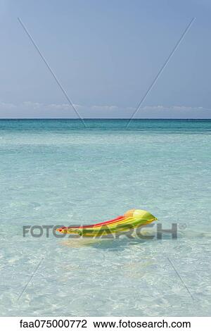 Pool raft floating in ocean View Large Photo Image Stock Image - Pool raft floating in ocean. Fotosearch