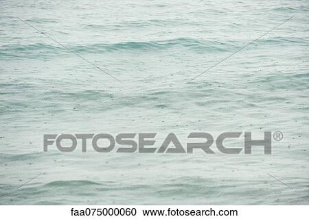 Raindrops hitting suface of water View Large Photo Image Stock Image - Raindrops hitting suface of water. Fotosearch