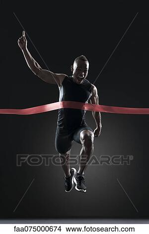 Runner crossing finish line View Large Photo Image Picture - Runner crossing finish line. Fotosearch
