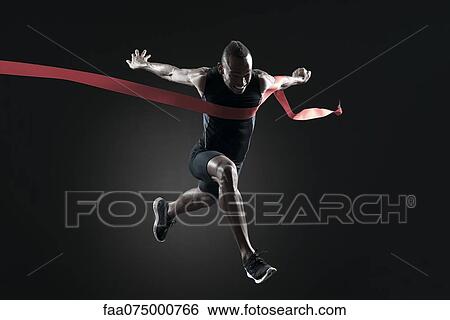 Runner crossing finish line View Large Photo Image Stock Photograph - Runner crossing finish line. Fotosearch