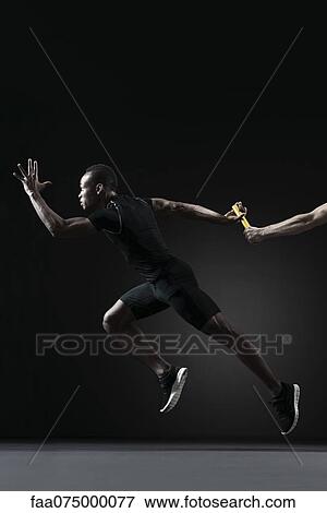 Runners passing baton View Large Photo Image Stock Photo - Runners passing baton. Fotosearch