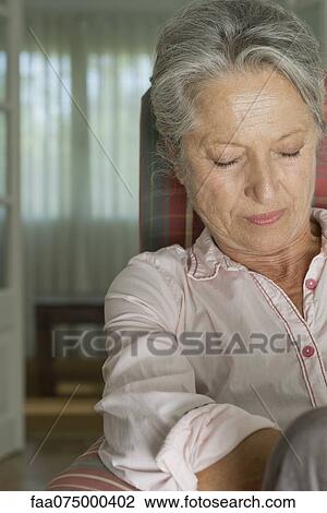Senior woman napping in armchair View Large Photo Image Stock Image - Senior woman napping in armchair. Fotosearch