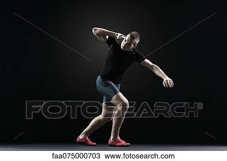 Shot putter preparing to throw shot View Large Photo Image Stock Image - Shot putter preparing to throw shot. Fotosearch