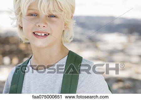 Stock Image - Smiling boy, portrait. Fotosearch