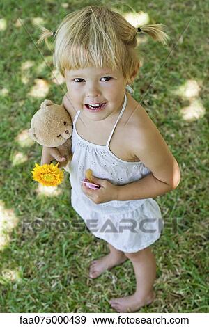 Stock Photo - Smiling little girl, portrait. Fotosearch