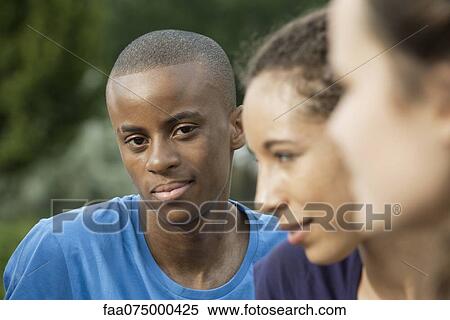 Smiling young man, outdoors View Large Photo Image Stock Photography - Smiling young man, outdoors. Fotosearch