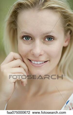 Smiling young woman, portrait View Large Photo Image Stock Image - Smiling young woman, portrait. Fotosearch