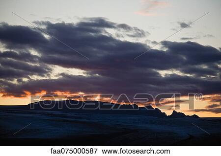 Sun setting over Jokulsarlon glacial lagoon, Iceland View Large Photo Image Stock Photo - Sun setting over Jokulsarlon glacial lagoon, Iceland. Fotosearch