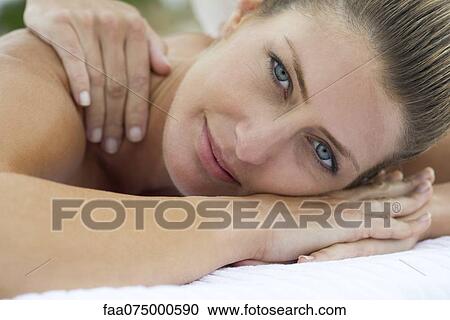 Stock Image - Woman getting a massage, portrait. Fotosearch