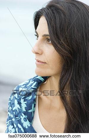 Woman looking away in thought, portrait View Large Photo Image Stock Photo - Woman looking away in thought, portrait. Fotosearch
