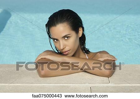 Woman relaxing in pool, portrait View Large Photo Image Stock Image - Woman relaxing in pool, portrait. Fotosearch