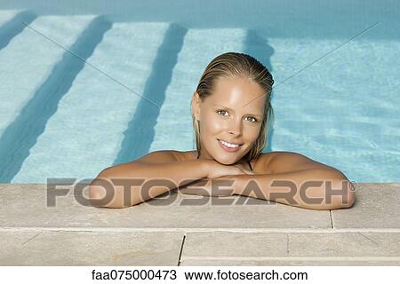 Woman relaxing in pool, portrait View Large Photo Image Stock Image - Woman relaxing in pool, portrait. Fotosearch