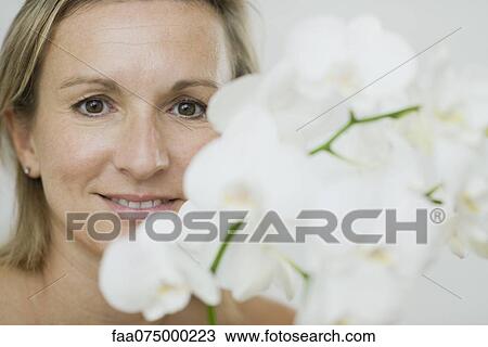 Woman with fresh flowers, portrait View Large Photo Image Stock Image - Woman with fresh flowers, portrait. Fotosearch