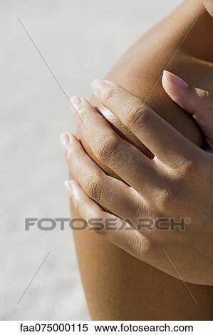 Woman's hand on bare shoulder, cropped View Large Photo Image Stock Photography - Woman's hand on bare shoulder, cropped. Fotosearch