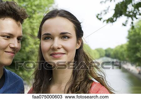 Stock Image - Young couple outdoors. Fotosearch