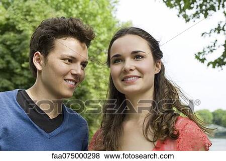 Young couple outdoors View Large Photo Image Stock Photo - Young couple outdoors. Fotosearch