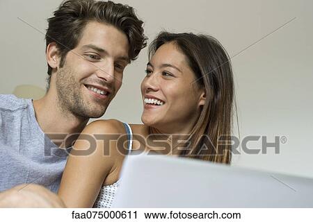 Young couple spending time together View Large Photo Image Stock Image - Young couple spending time together. Fotosearch