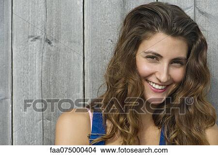 Picture - Young woman smiling, portrait. Fotosearch