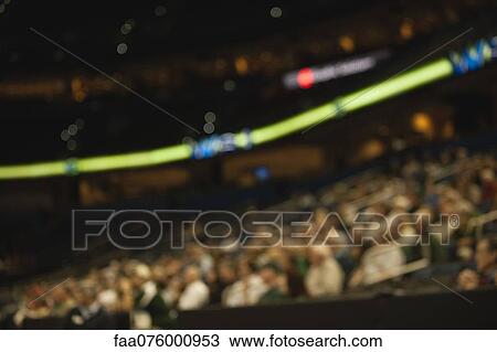 Stock Image - Audience in stadium, defocused. Fotosearch