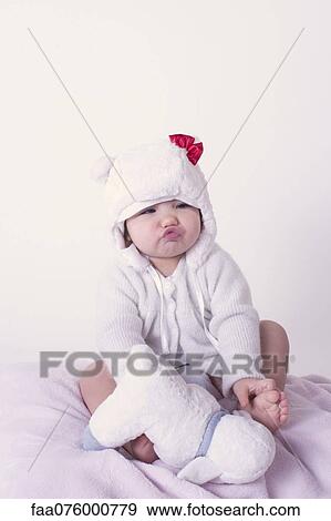 Baby girl pursing lips, portrait View Large Photo Image Stock Photo - Baby girl pursing lips, portrait. Fotosearch