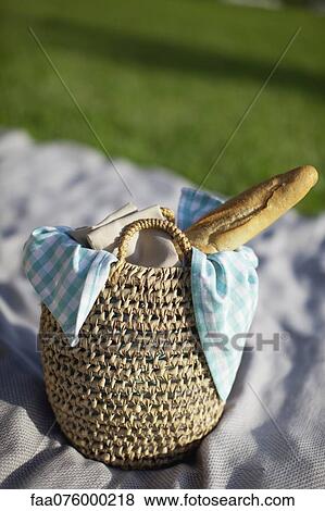 Stock Photo - Baguette in picnic basket. Fotosearch