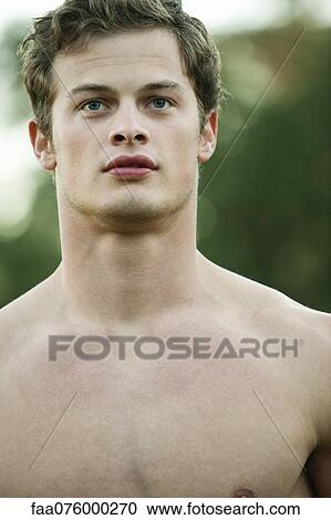 Stock Image - Barechested young man, portrait. Fotosearch