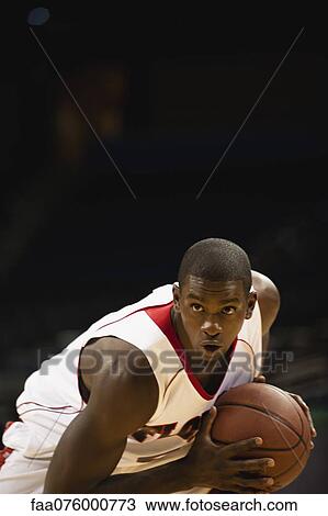 Stock Image - Basketball player concentrating on game. Fotosearch