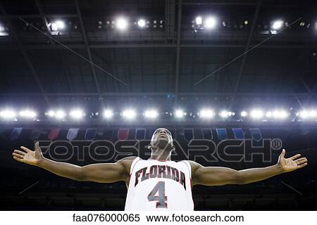 Stock Photography - Basketball player with arms outstretched. Fotosearch