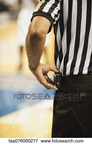 Stock Photo - Basketball referee, cropped rear view. Fotosearch