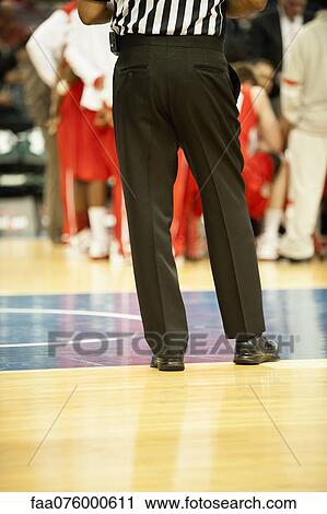 Stock Image - Basketball referee, cropped. Fotosearch