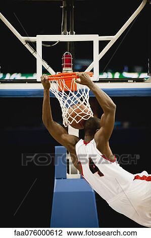 Basketball slam dunking, rear view View Large Photo Image Stock Image - Basketball slam dunking, rear view. Fotosearch