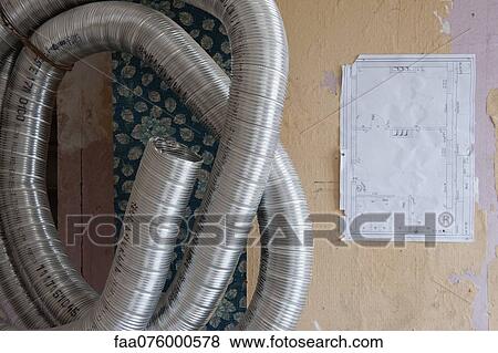 Stock Photo - Blueprint and metal pipe. Fotosearch
