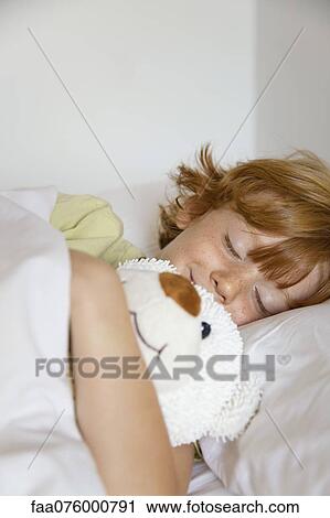Boy sleeping in bed View Large Photo Image Stock Image - Boy sleeping in bed. Fotosearch