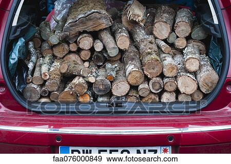 Car trunk with pile of firewood View Large Photo Image Stock Photo - Car trunk with pile of firewood. Fotosearch