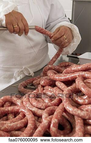 Chef making fresh sausage View Large Photo Image Stock Photography - Chef making fresh sausage. Fotosearch