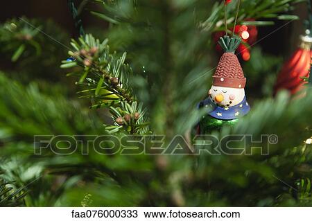 Christmas ornament hanging on Christmas tree View Large Photo Image Stock Image - Christmas ornament hanging on Christmas tree. Fotosearch
