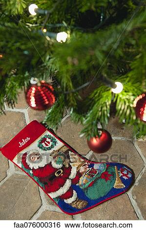 Stock Photograph - Christmas tree and Christmas stocking. Fotosearch