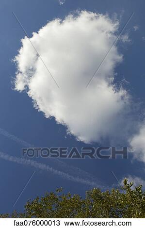 Stock Image - Cloud in blue sky. Fotosearch