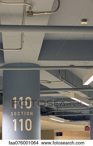 Picture - Concrete column with section number "110". Fotosearch